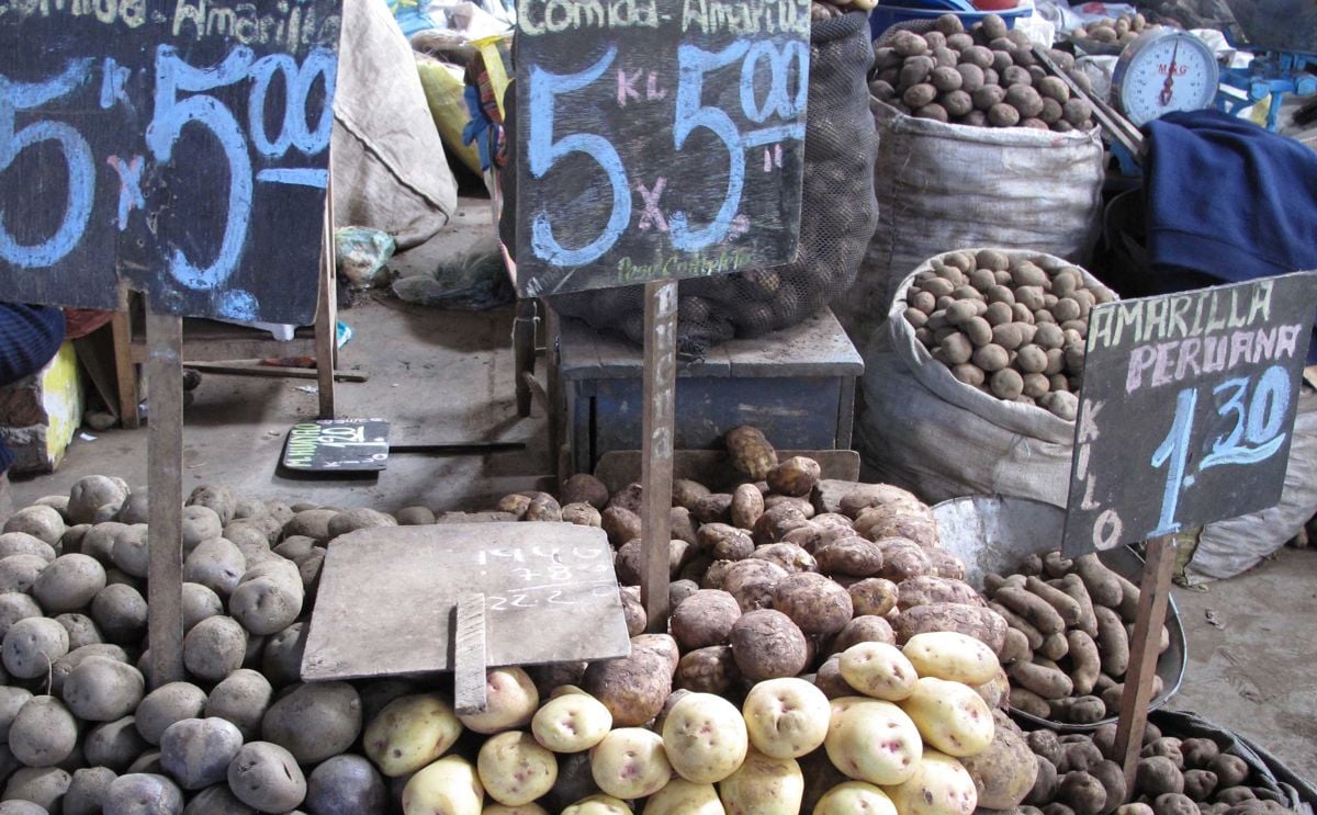 La Paz, Plurinational State of Bolivia. Potatoes displayed at a street stall in Mercado Rodríguez market. La Paz, Plurinational State of Bolivia. Potatoes displayed at a street stall in Mercado Rodríguez market.